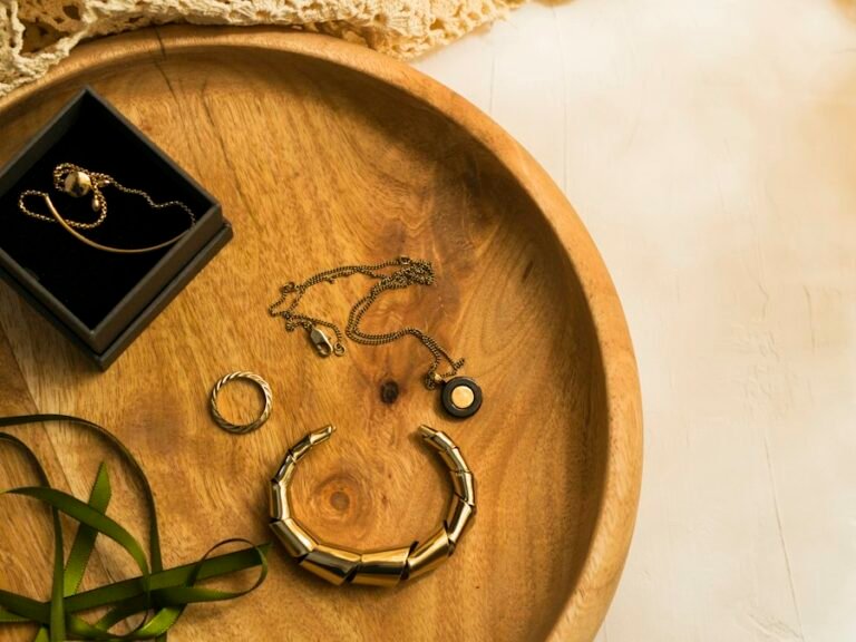 Gold-plated necklaces and bracelet in a wooden bowl